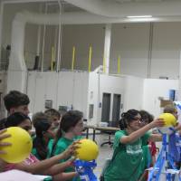 Students compete in the paper tower competition with Physics Olympics